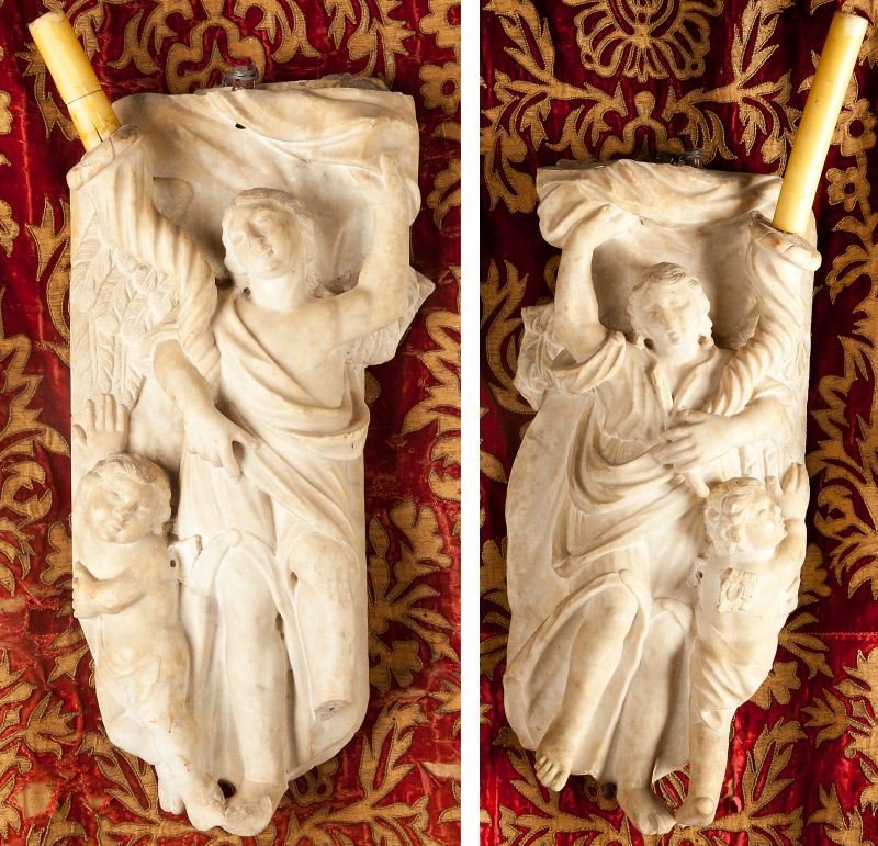 Pair of Grecian Style White Marble Plaques: Pair of Grecian Style White Marble Plaques 18th century, modeled with classical women each holding a cornucopia, cherub below. 25 x 12 in.