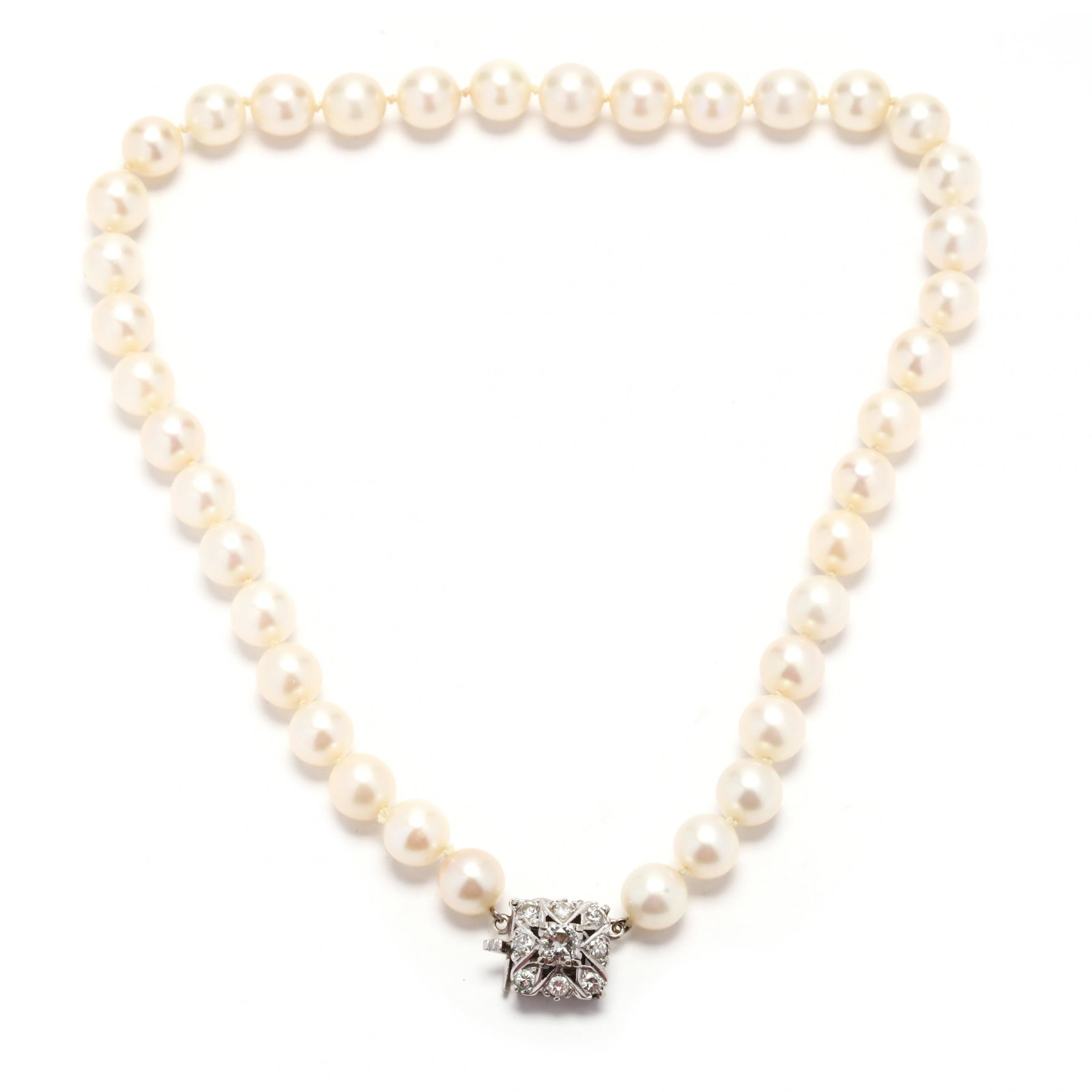 Pearl Necklace with White Gold and Diamond Clasp: Pearl Necklace with White Gold and Diamond Clasp necklace strung knotted with (38) round cultured pearls (8.0mm - 8.5mm) and completed with square form clasp set with full cut round diamonds weighing 