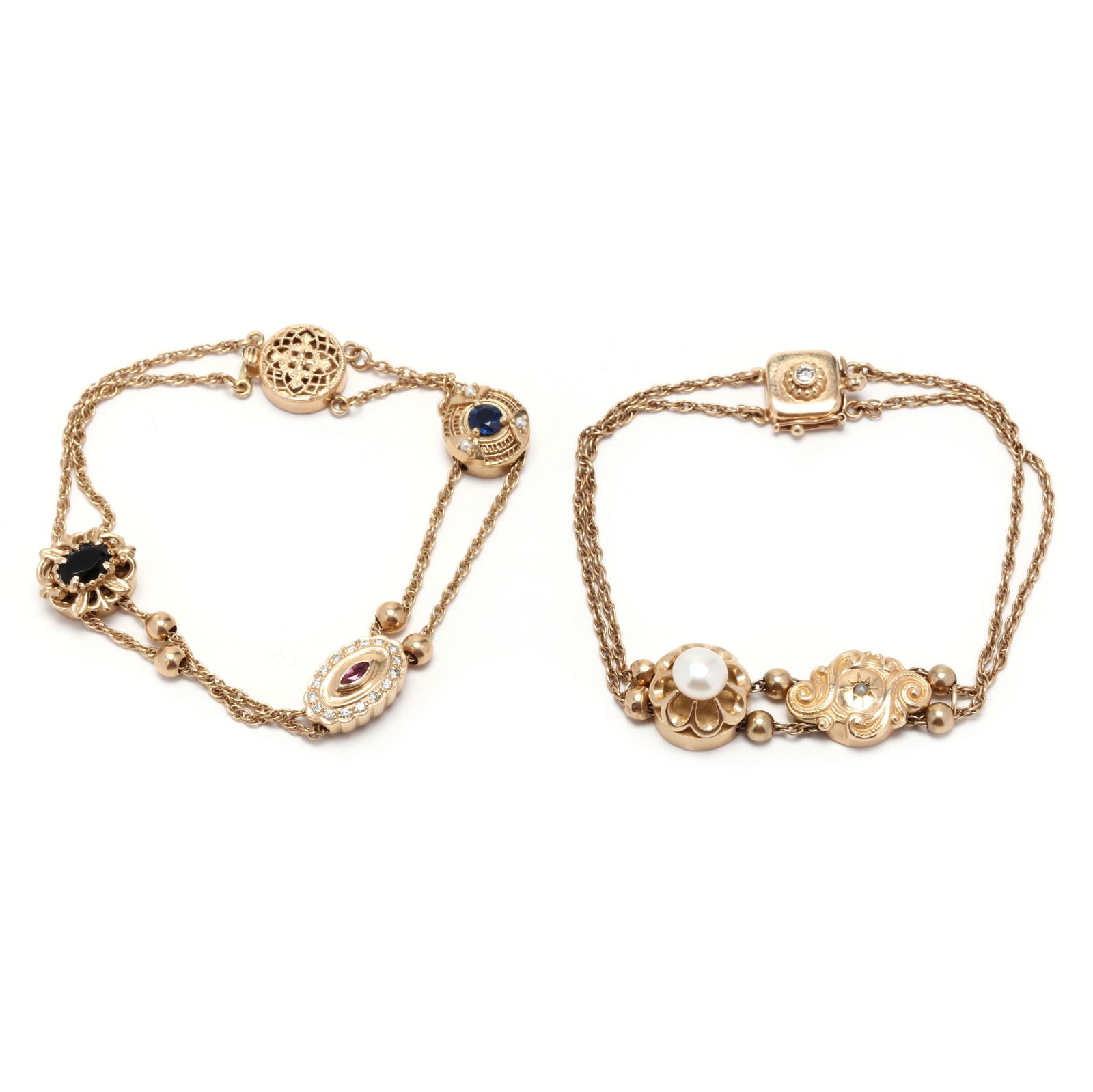 Two Gold and Gem-Set Slide Charm Bracelets: Two Gold and Gem-Set Slide Charm Braceletsone with two pearl-set charm slides and with a diamond set clasp, slides and clasp stamped 14K (7 in.); and one with three gem-set charm slides completed with