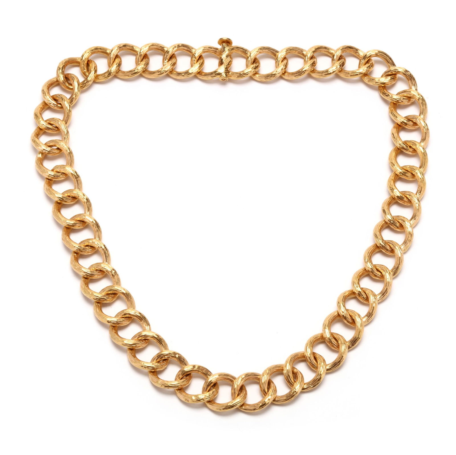 High Karat Gold Link Necklace: High Karat Gold Link Necklacenecklace comprised of oval gold links with textured detailing to one side and completed with a pin clasp stamped 7F22, XRF analysis testing 22KT. 5/8 x 18.25 in. 37.3 dwt.