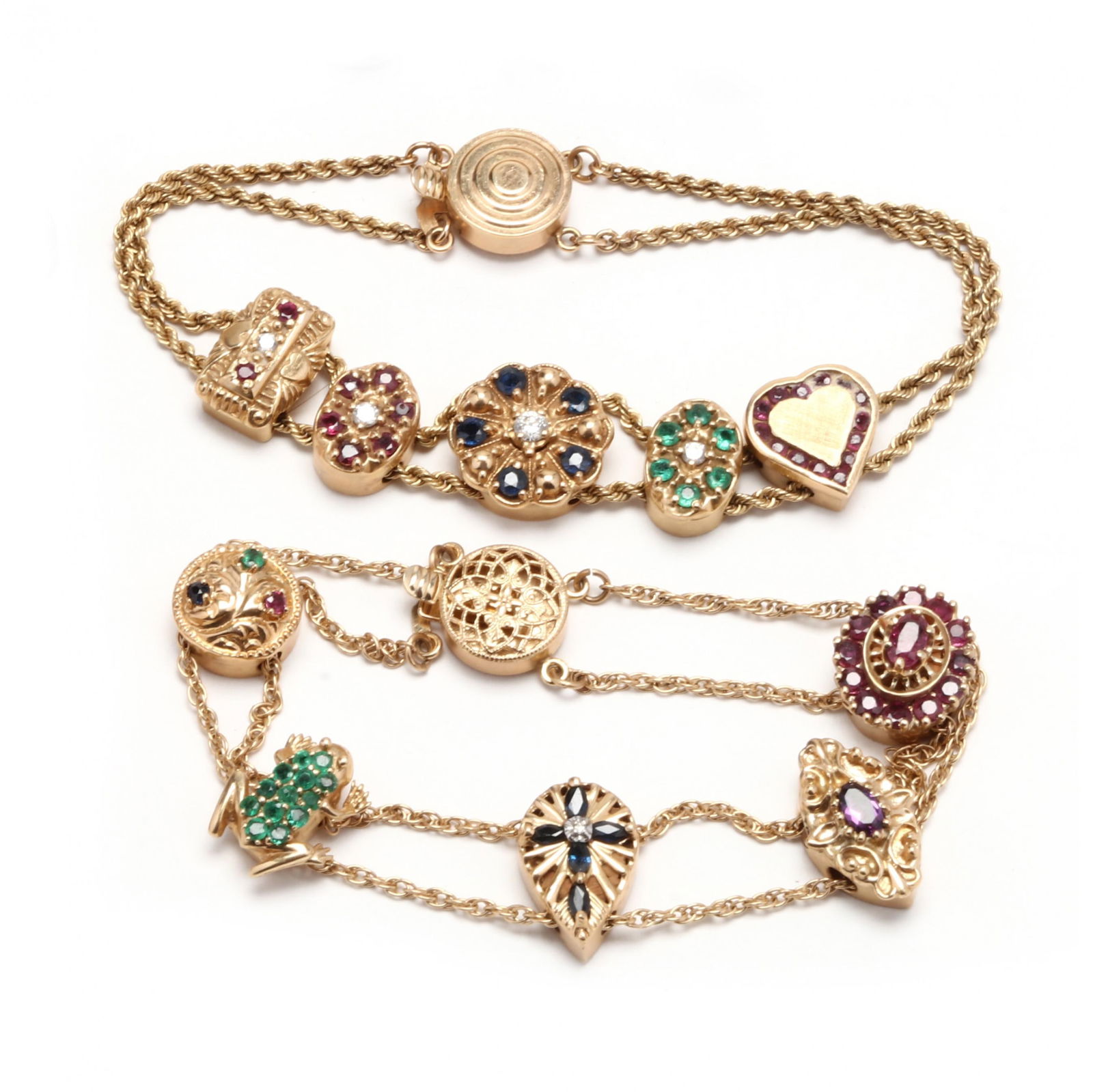Two Gold and Gem-Set Slide Charm Bracelets: Two Gold and Gem-Set Slide Charm Braceletsone with five charms set with multi-color gemstones and diamond melee, each charm stamped 14K, clasp stamped 14K (7 in.) (heart charm missing some stones); an