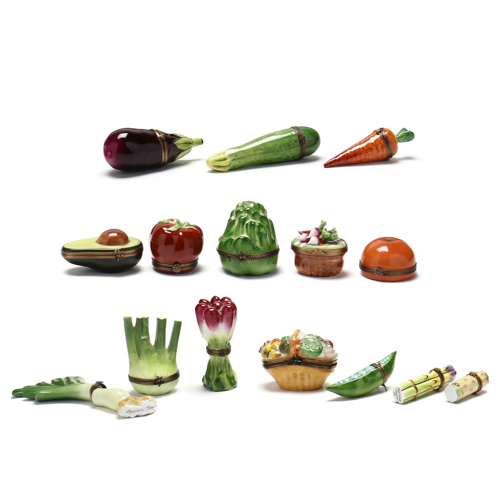 A Selection of Limoges Pill Boxes in the Form of Vegetables: A Selection of Limoges Pill Boxes in the Form of Vegetables(15) fifteen including (2) vegetable baskets, tomatoes, onions and others. Radish 3 3/4 in. Collection of a Lady, Memphis, Tennessee Addition