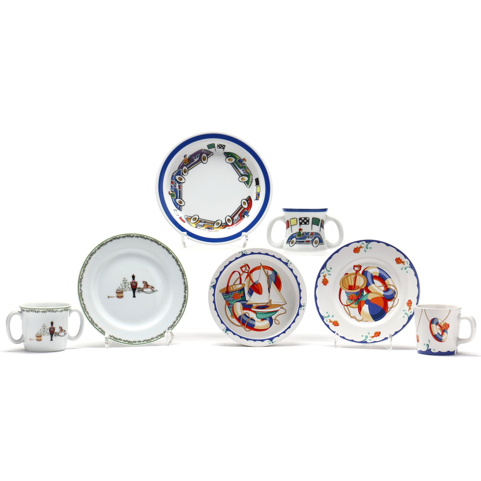 Seven China Table Items for a Child: Seven China Table Items for a Childto include: a four (4) piece set Tiffany Seashore made by Tiffany & Co.; a 2002 double handled mug decorated with race cars by Tiffany & Co.; a Bernardaud Limoges m
