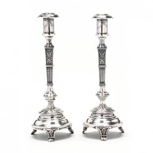 A Pair of Polish .800 Silver Repousse Candlesticks: A Pair of Polish .800 Silver Repousse Candlesticks circa 1920-1931 period mark, stamped "FiK", baluster form, foliate and neoclassical decoration in high relief on a stippled ground, raised on three