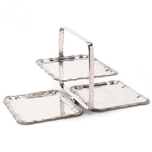 A Mexican Sterling Silver Folding Serving Stand: A Mexican Sterling Silver Folding Serving Standmark of Alfredo Ortega & Sons, pattern number 333â˜…2, opens to reveal two rectangular trays and a central conforming tray that rotates upright withi