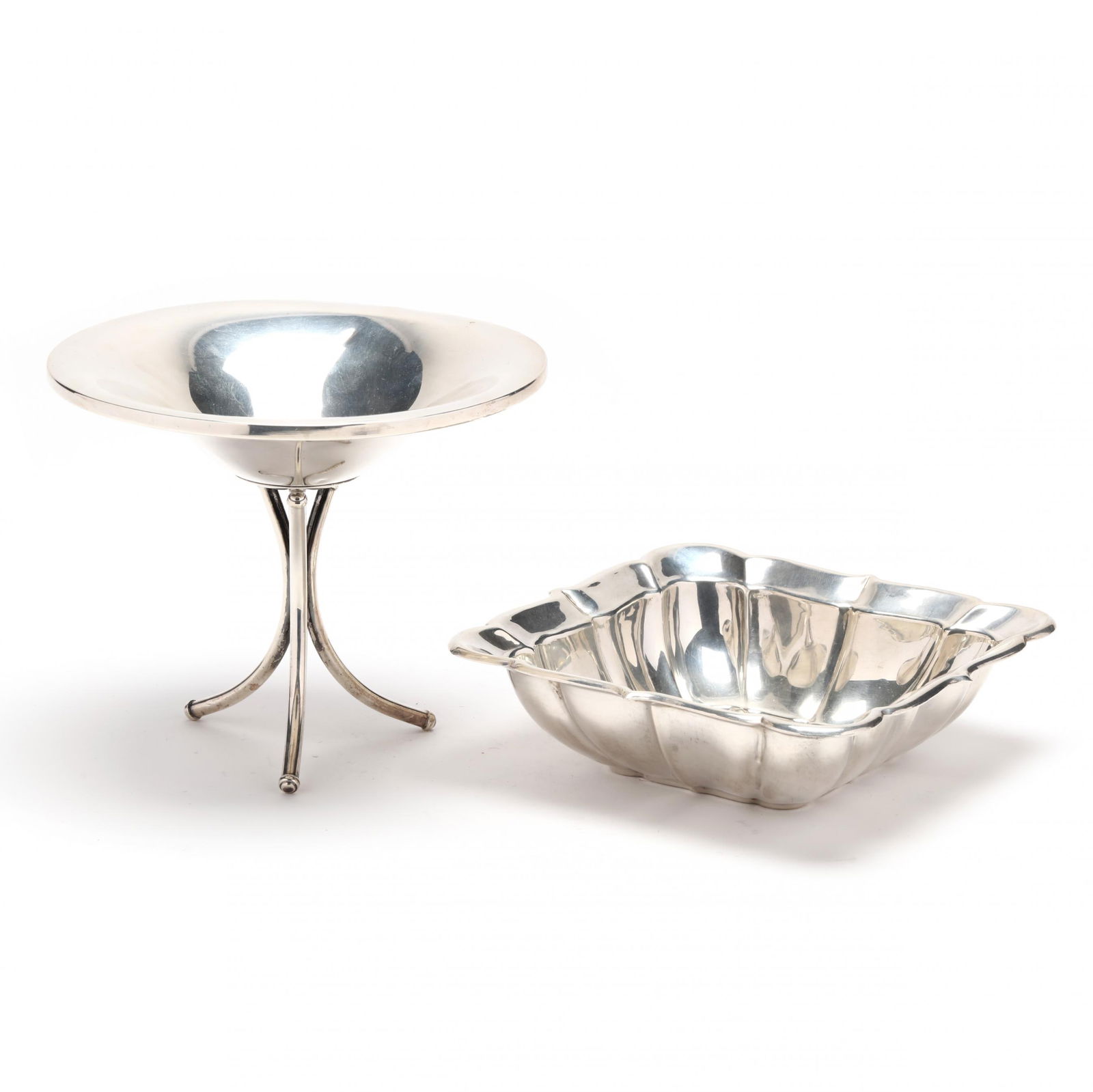 Two Sterling Silver Table Accessories by Fisher: Two Sterling Silver Table Accessories by Fisherthe first a modernist tri-foot raised compote, round form with weighted bowl, pattern number 920; the second a small square form bowl with a scalloped ri