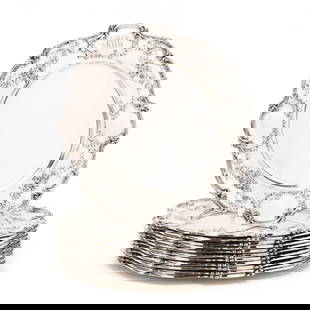 A Set of Twelve Gorham Sterling Silver Service Plates: A Set of Twelve Gorham Sterling Silver Service Platespattern number A6620, scrolled scalloped rims, the borders with alternating floral bouquet sprays and cartouche decoration, each with script monogr