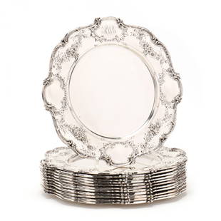 A Set of Twelve Gorham Sterling Silver Service Plates: A Set of Twelve Gorham Sterling Silver Service Platespattern number A6620, scrolled scalloped rims, the borders with alternating floral bouquet sprays and cartouche decoration, each with script monogr