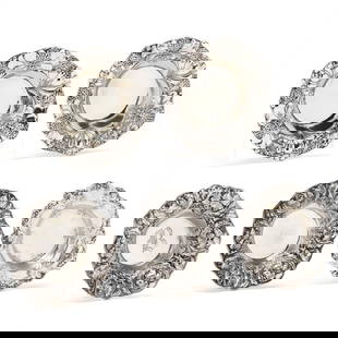 Five Sterling Silver Nut Bowls by Gorham: Five Sterling Silver Nut Bowls by Gorhamincludes (2) in pattern A2569, with thistle decorated rim; (2) in pattern A3975, with iris-decorated rim, monogrammed wells; and (1) in pattern 816, scalloped r