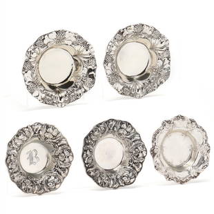 Five Sterling Silver Nut Bowls by Gorham: Five Sterling Silver Nut Bowls by Gorhamincludes (2) in pattern A2569, with thistle decorated rim; (2) in pattern A3975, with iris-decorated rim, monogrammed wells; and (1) in pattern 816, scalloped r