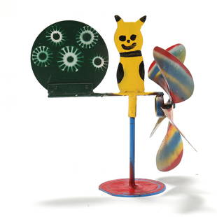 Vollis Simpson (NC, 1919-2013), Whirligig with Yellow Feline: Vollis Simpson (NC, 1919-2013), Whirligig with Yellow Feline2008, painted metal, comprised of a yellow feline-type figure seated between a fan propeller and disc tail, mounted atop a rod and disc stan