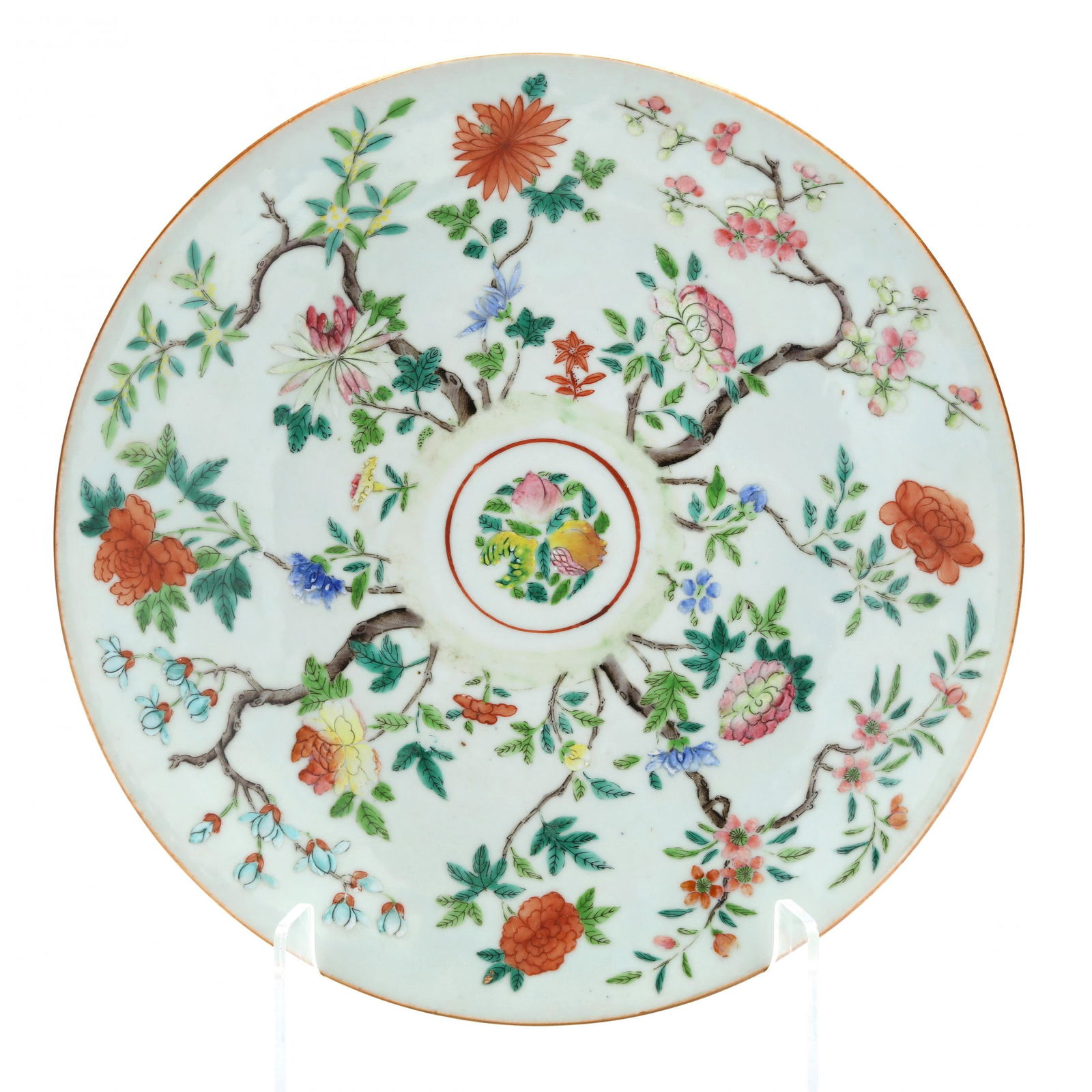 A Chinese Porcelain Famille Rose Charger: A Chinese Porcelain Famille Rose Charger19th century, very light celadon ground glaze hand painted in polychrome enamels with four blooming trees and various large flowers surrounding a circle medalli
