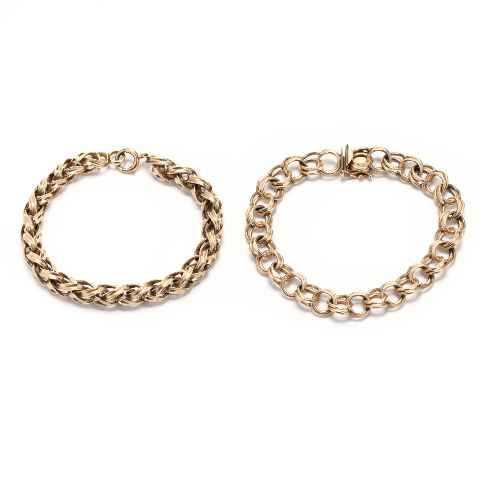 Two Gold Link Bracelets: Two Gold Link Braceletsone with double oval links completed in an integrated clasp stamped 14K and with a maker's mark (9mm x 7.5 in.); and one in a spiga design completed with a spring ring clasp, st
