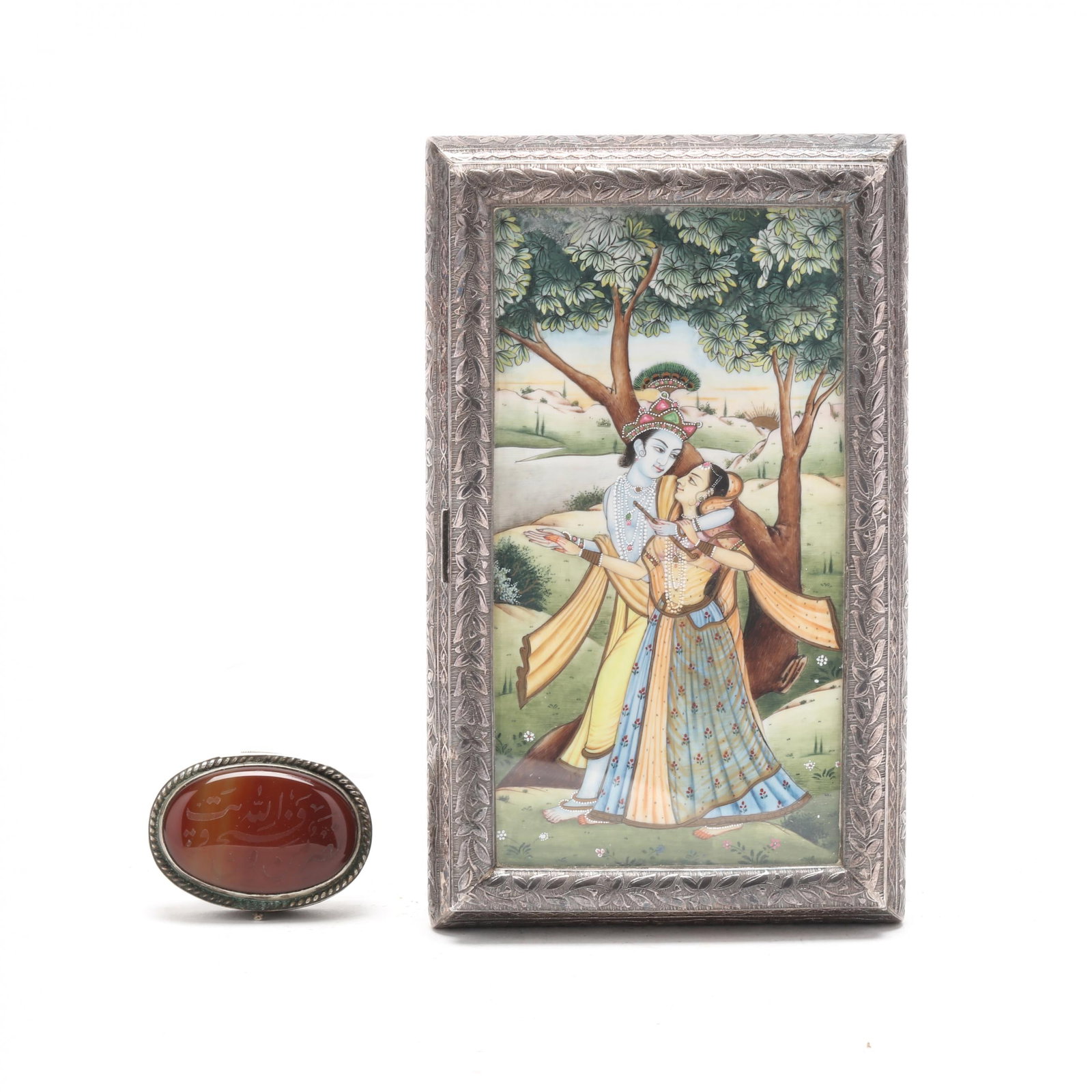 Two Silver Vintage Decorative Boxes: Two Silver Vintage Decorative Boxes20th century, to include: the first, a hinged box with floral patterns, lid with painting of Krishna and Radha in a landscape under plexiglass, unmarked, acid tests