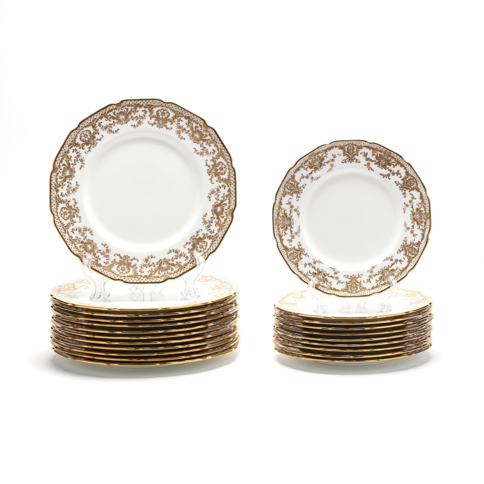 Set of Royal Doulton Dinner and Salad Plates: Set of Royal Doulton Dinner and Salad Plates late 19th-early 20th century, England, to include (12) dinner plates and (10) salad plates, each white with gilt scroll and foliage pattern, raised highlig