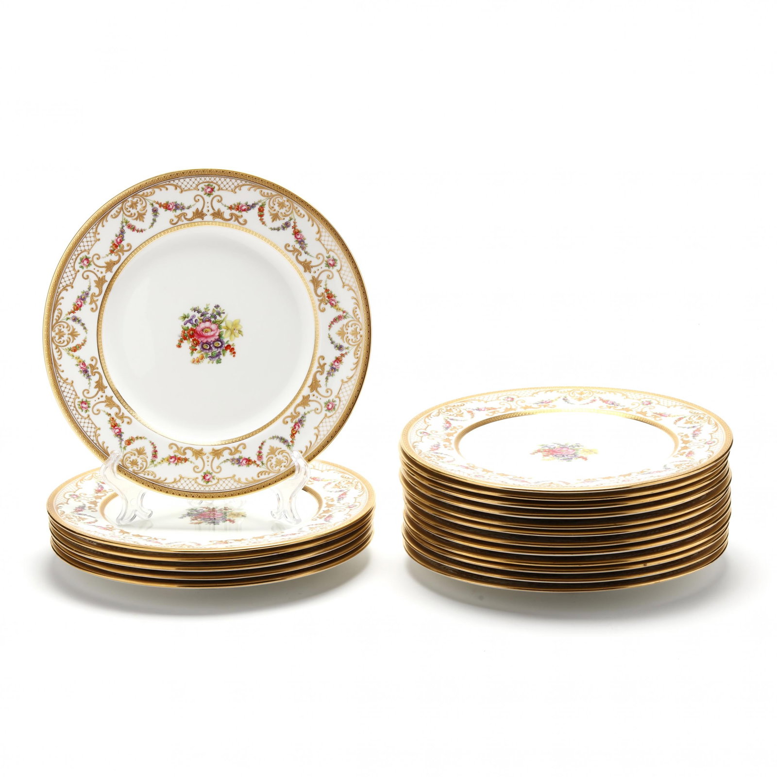 Set of (18) Aynsley Dinner Plates: Set of (18) Aynsley Dinner Plates 20th century, English, pattern 5945, each with a wide lip with gilt and floral decoration, raised highlights and beading, and a central hand-painted floral design, so