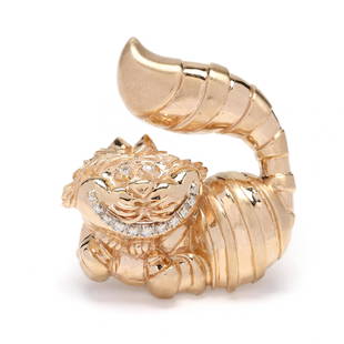 Gold and Diamond Cheshire Cat Brooch, Disney: Gold and Diamond Cheshire Cat Brooch, Disney figural brooch depicting the Cheshire Cat from Disney's Alice in Wonderland, his iconic smile and his eyes set with full cut round diamonds weighing