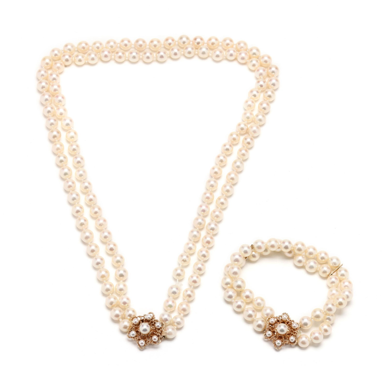 Double Strand Pearl and Gold Suite: Double Strand Pearl and Gold Suite to include a double strand necklace and bracelet, the necklace strung knotted with (57) and (60) round cultured pearls (7.6mm - 7.8mm) and completed with starburst m