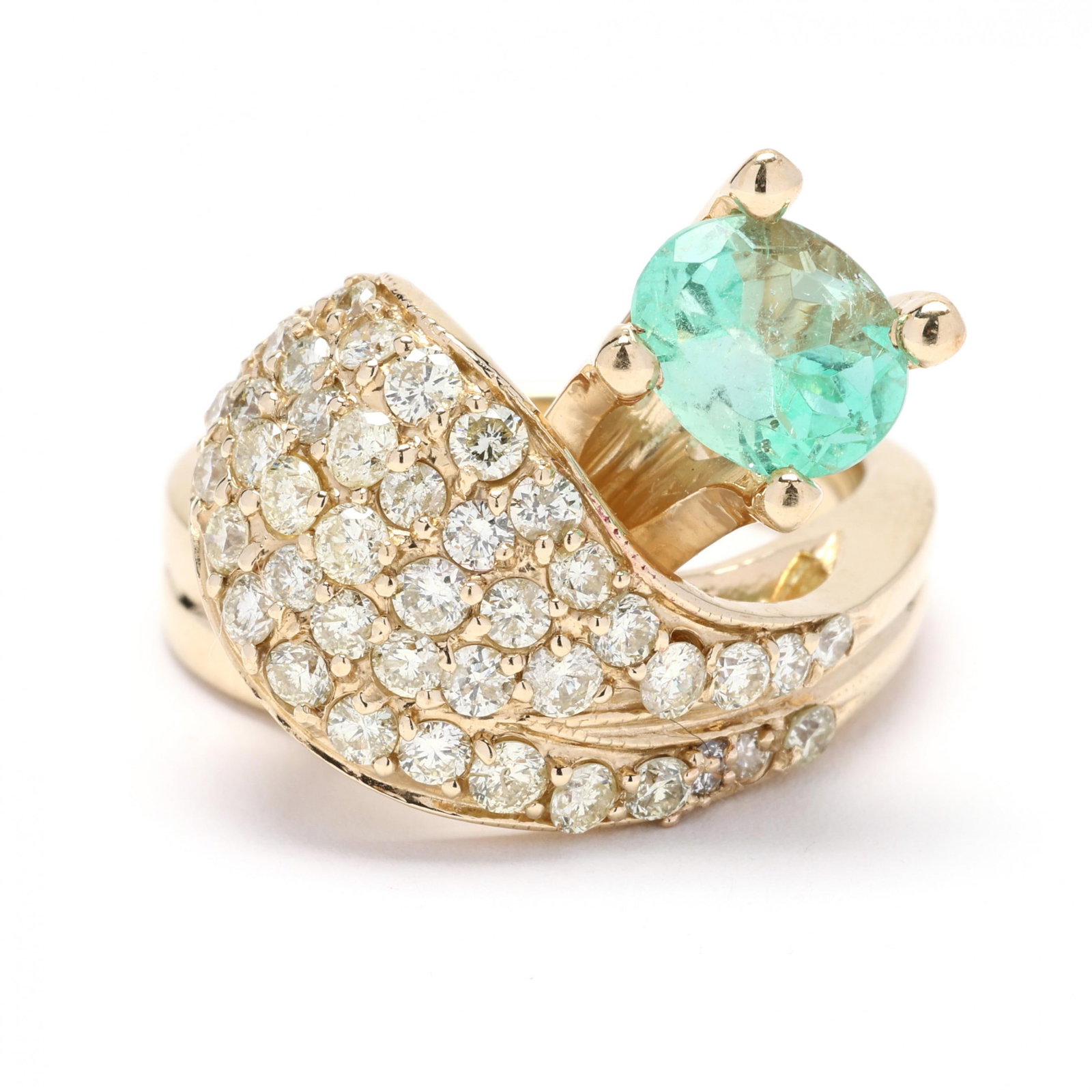 Gold, Tourmaline, and Diamond Bypass Ring: Gold, Tourmaline, and Diamond Bypass Ring in a bypass design prong set with an oval cut green tourmaline (17.8 x 6.5 x 5.73 mm) weighing approximately 3.95 carats and the bypass element bead set with 
