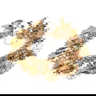 Gold Charm Bracelet with Charms: Gold Charm Bracelet with Charmsthe charm bracelet in high polish yellow gold with rope twist detailing to center and stamped 14K suspending (23) charms in various motifs to include: a pagoda, horse dr