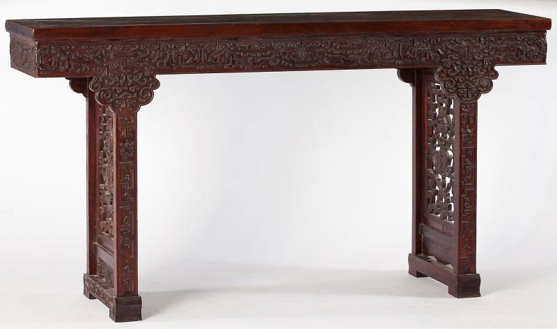 Antique Chinese Altar Table: Antique Chinese Altar Tablecirca 1900 or earlier, hardwood, rectangular form with relief carving, top having a pierced and carved linear supports at each end, raised on shoe feet.34.5 x 65 x 16 in.