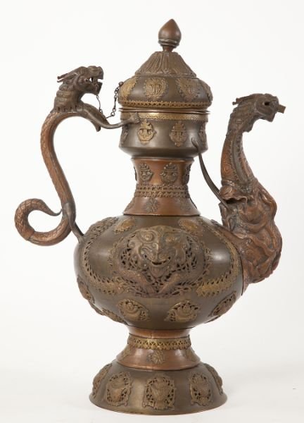 Persian Bath Ewer: Persian Bath Ewer 19th century, brass and copper, pear shaped with scrolled dragon handle and dragon spout, decorated in high relief, dome covered lid with bud finial. 33.5 in. Purchased at the Chinqu