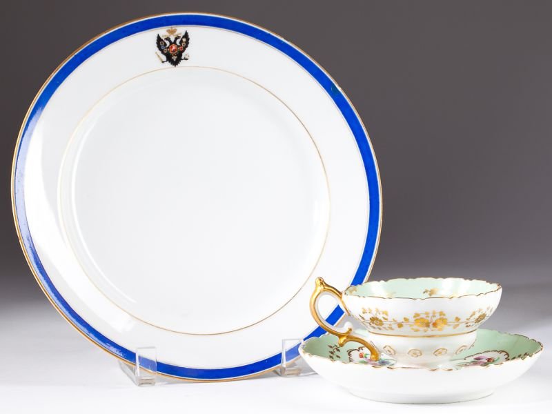 Two Examples of Russian Imperial Factory Porcelain: Two Examples of Russian Imperial Factory Porcelain made in St. Petersburg, the first a matching cup and saucer, each bearing the crowned cypher of Nicholas I (1825 - 1855), apple green with floral spr