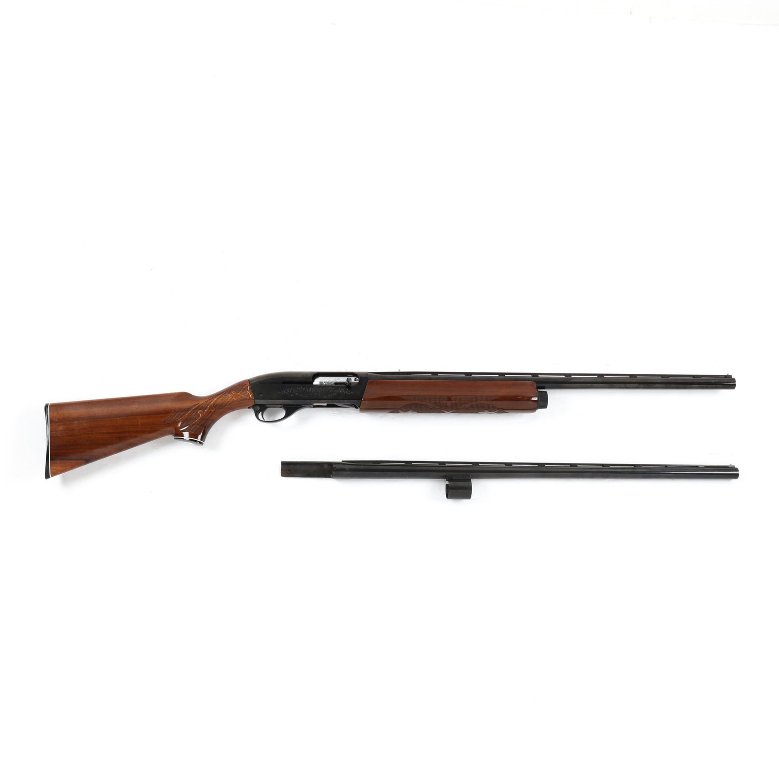 Remington 12 Gauge Model 1100 Semi-Automatic Shotgun with Extra Barrel: Remington 12 Gauge Model 1100 Semi-Automatic Shotgun with Extra Barrel serial number N124424V on receiver, 25.5 in. blued barrel marked REMINGTON ARMS CO., INC / ILION, N.Y., MADE IN U.S.A / 12 GA. FO