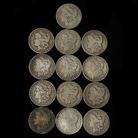 Thirteen Circulated Morgan Silver Dollars, One with Carson City Mintmark
