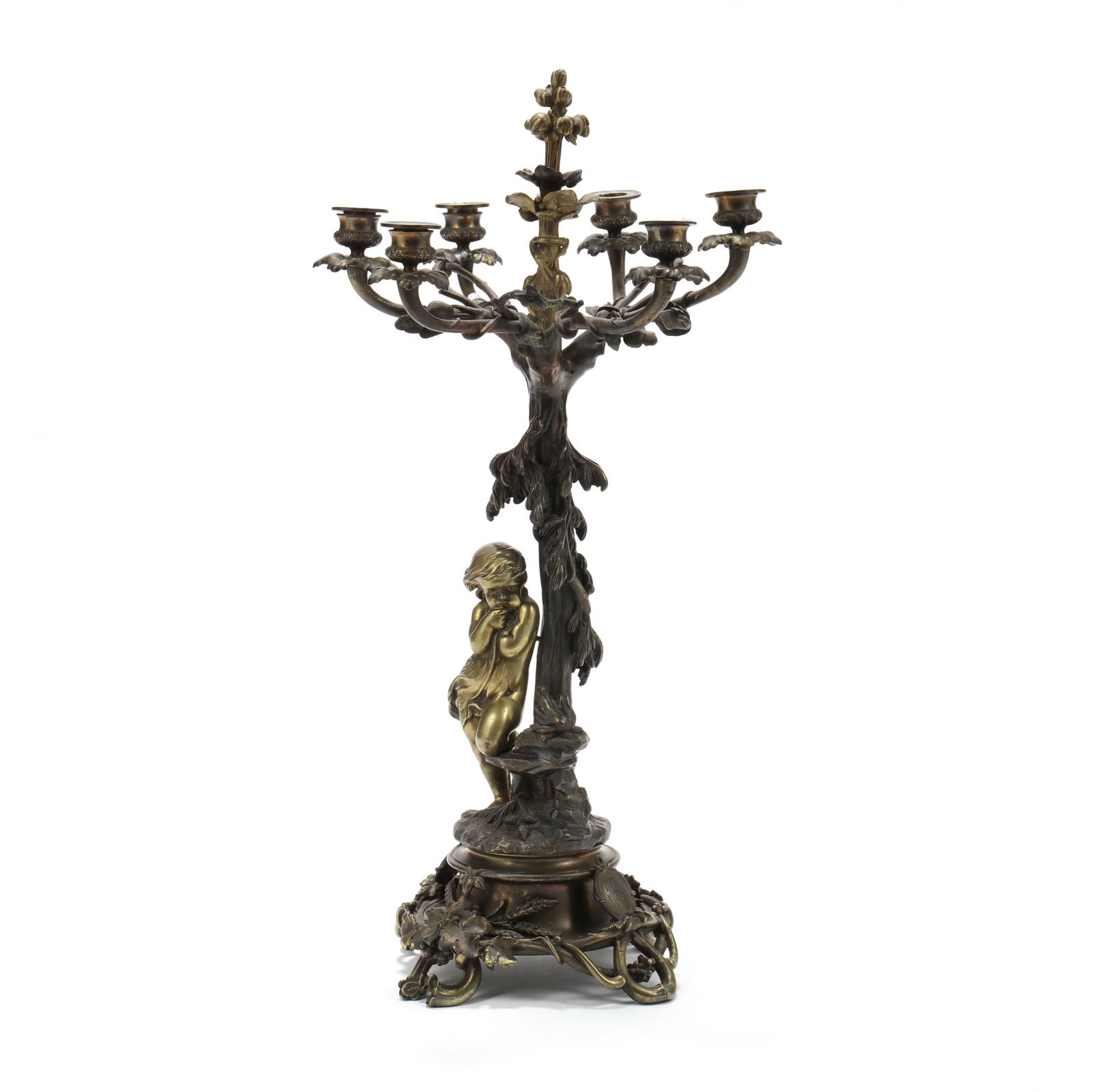 Antique Christofle Bronze Six-Light Figural Candelabrum: Antique Christofle Bronze Six-Light Figural Candelabrum circa 1880s, with 1862-1935 company marks to underside, tree form column featuring a nude putti leaning near a fire, raised on a waisted socle f
