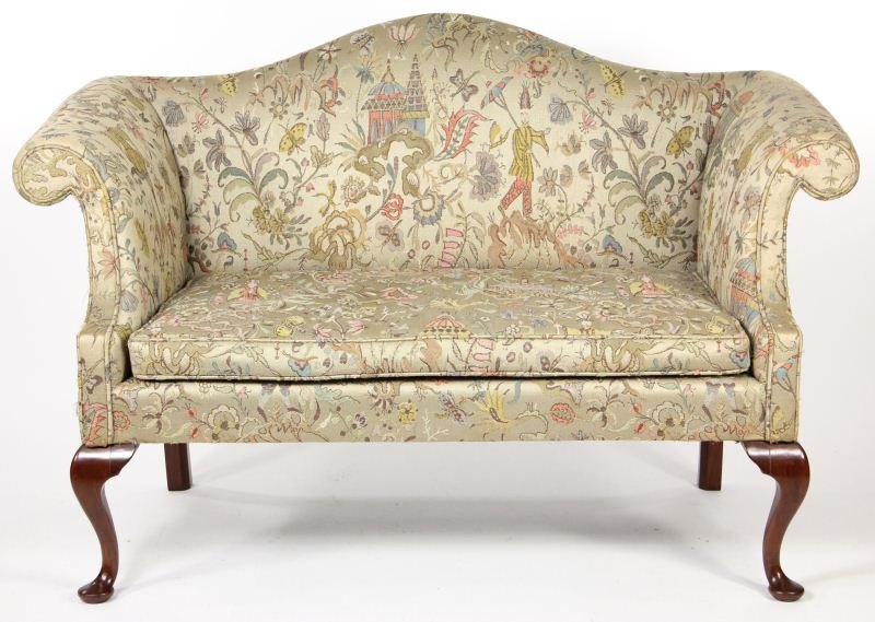 Chippendale Style Camel Back Settee: Chippendale Style Camel Back Settee with removable seat cushion, scrolled arms, two front cabriole legs, finely upholstered in a gold Chinoiserie fabric 33.5 x 52.5 x 24 in.