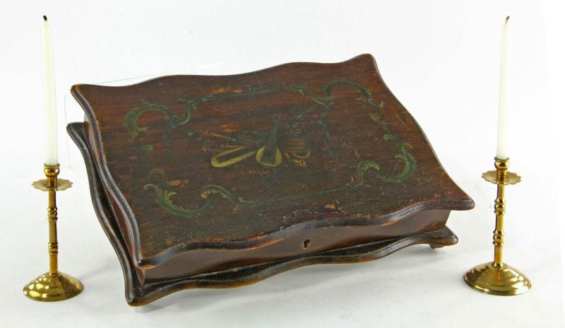 Decorative Table Accessories: Decorative Table Accessoriesincluding a vintage paint decorated box and a pair of diminutive brass candlesticks with petal form bobeche. Box 2.25 x 10.25 x 7.25 in.; Candlestick 3 in.