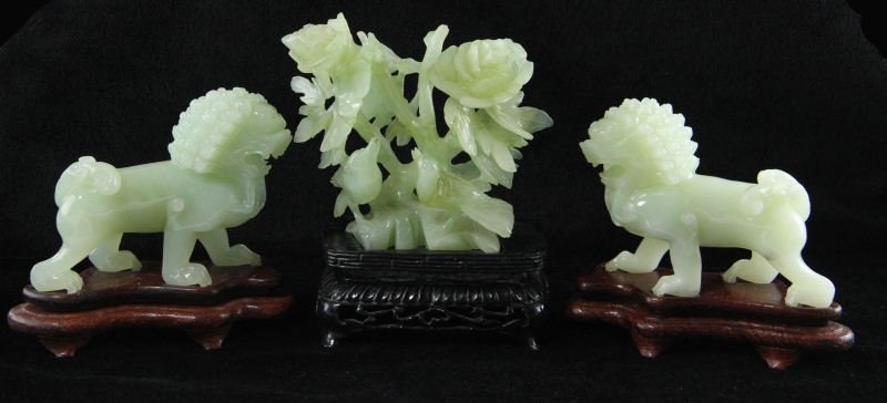 Three Modern Chinese Hardstone Carvings: Three Modern Chinese Hardstone Carvings including a pair of Buddhist lions on hardwood stands (HOA 4.5 in.; no apparent condition concerns); the third carving of birds on a floral branch with hardwood