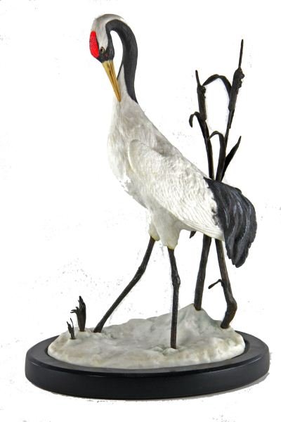 "The Japanese Crane" by Carl Regutti: "The Japanese Crane" by Carl Regutti issued in 1985 by the Franklin Mint, ceramic with bronze cattails mounted to an ebonized base. 16.5 in.