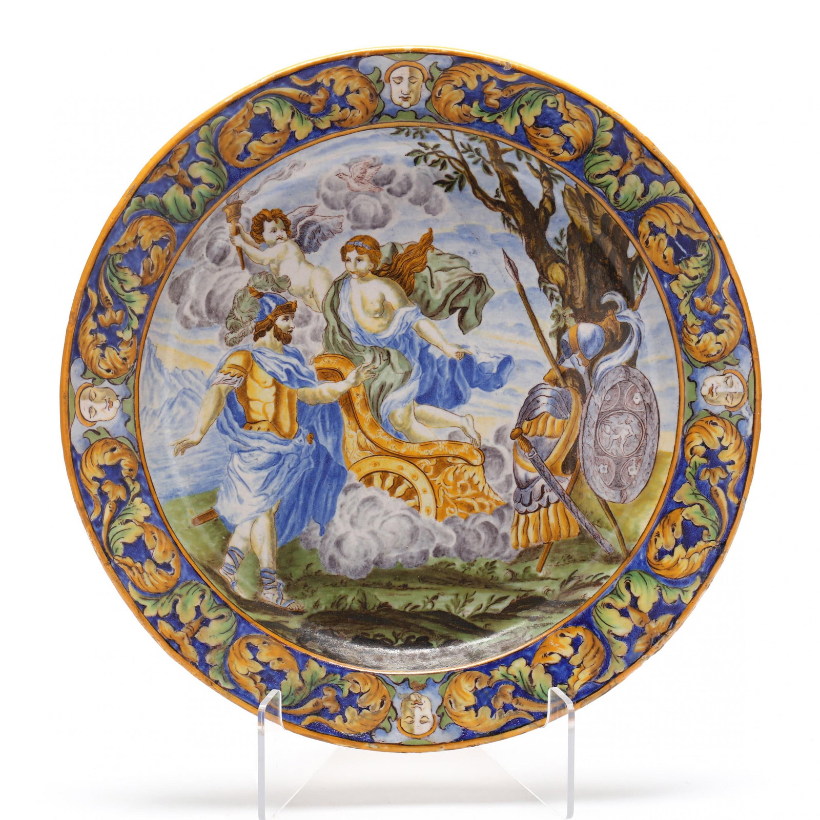 Majolica Istoriato Charger: Majolica Istoriato Charger Italy, late 19th century, painted in typical underglaze oxides, the scene shows Ares receiving armor from Hephaestus. According to Greek mythology, Ares, the god of war, was