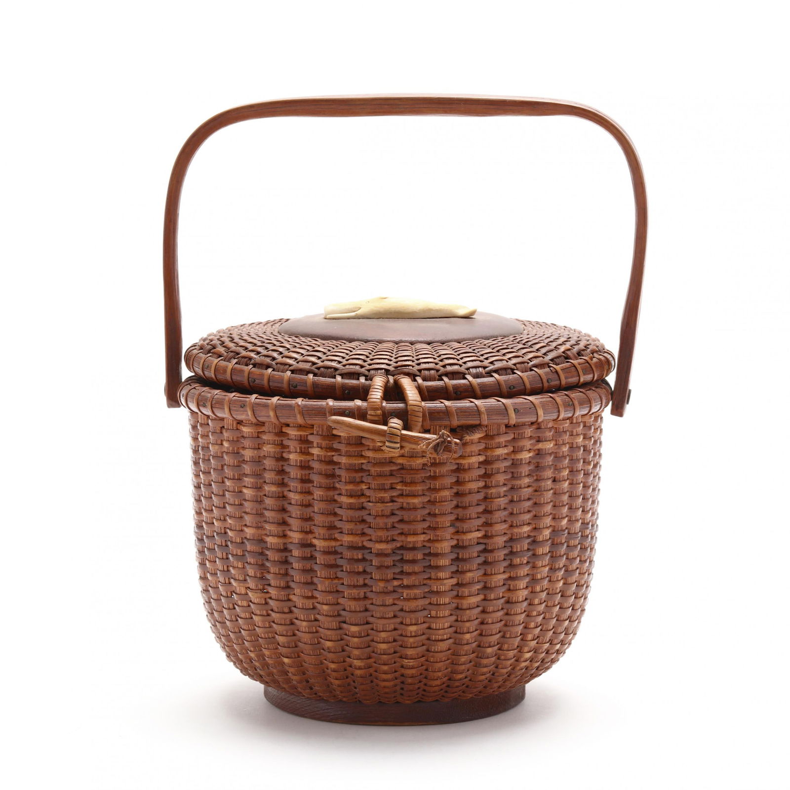 Jose Formosa Reyes (Filipino/American, 1902-1980), Nantucket Friendship Basket: Jose Formosa Reyes (Filipino/American, 1902-1980), Nantucket Friendship Basketcirca 1960s, caned cylindrical purse form "friendship" basket, with carved wood swing handle, cover with reeded hinges fea