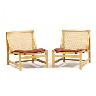 Rud Thygesen and Johnny Sorensen, Pair of  Kongserien  or "King Series" Lounge Chairs: Rud Thygesen and Johnny Sorensen, Pair of Kongserien or "King Series" Lounge Chairs1970s, oak frames, cane back and seat, reddish-brown leather pad seat, unmarked. 27.25 x 24 x 27.5 in. Created for th