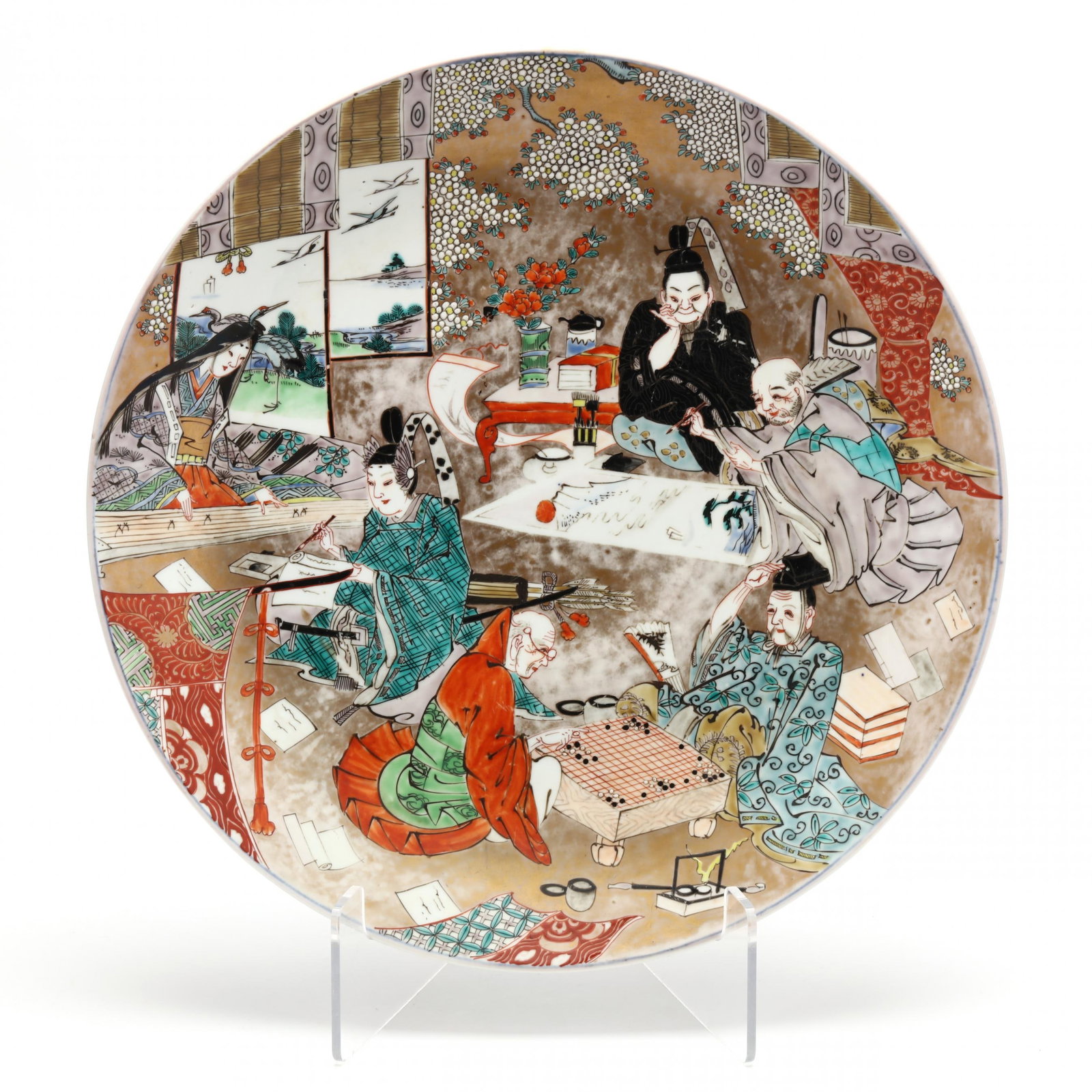 A Japanese Porcelain Charger with Figures: A Japanese Porcelain Charger with FiguresMeiji period (1868-1912), 19th century, large porcelain charger finely painted with figures engaged in the various noble pursuits of a Chinese scholar gentleme