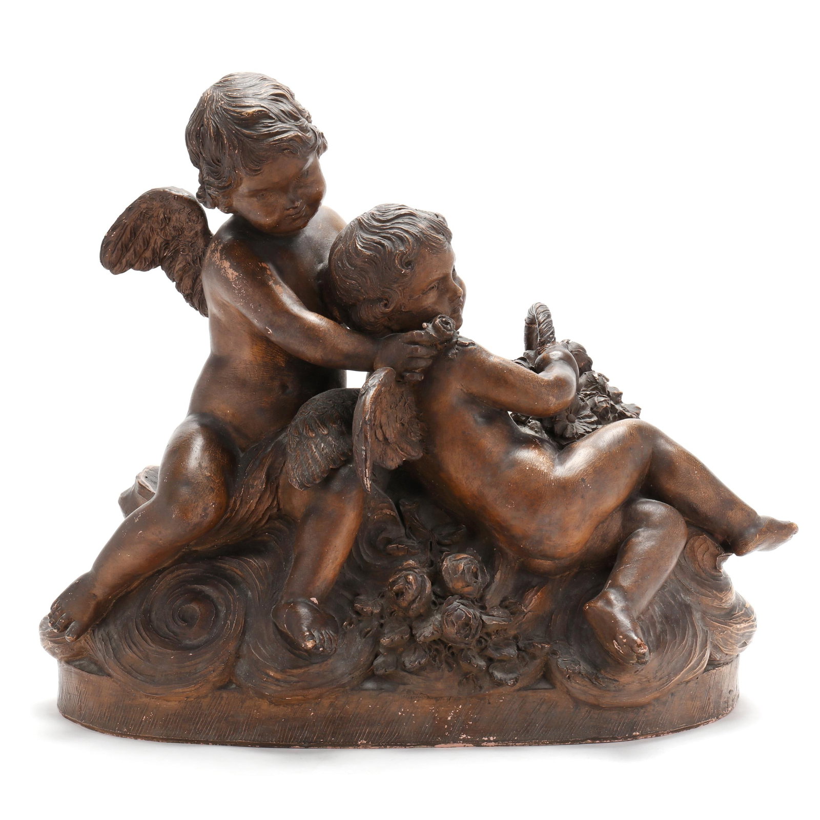 A Continental Terracotta Sculpture of Two Putti: A Continental Terracotta Sculpture of Two Putti late 19th or early 20th century, stained terracotta, featuring two putti holding a basket of flowers on a naturalistic base, unsigned. 16 x 19 x 11 in. 