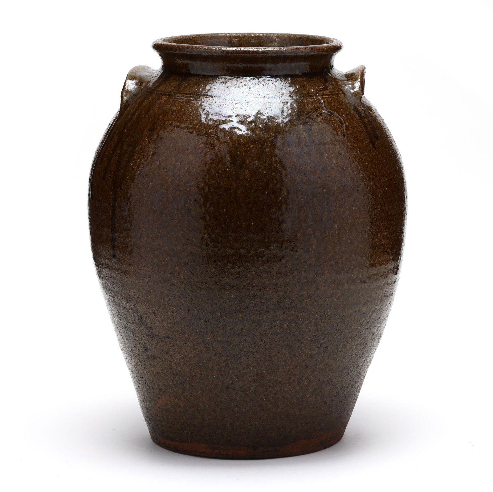 Western NC Alkaline Glaze Large Storage Jar in the Seagle School Style: Western NC Alkaline Glaze Large Storage Jar in the Seagle School Style19th century, an ovoid form featuring the raised rounded rim and the upturned lug handles commonly used by John Goodman, with thre