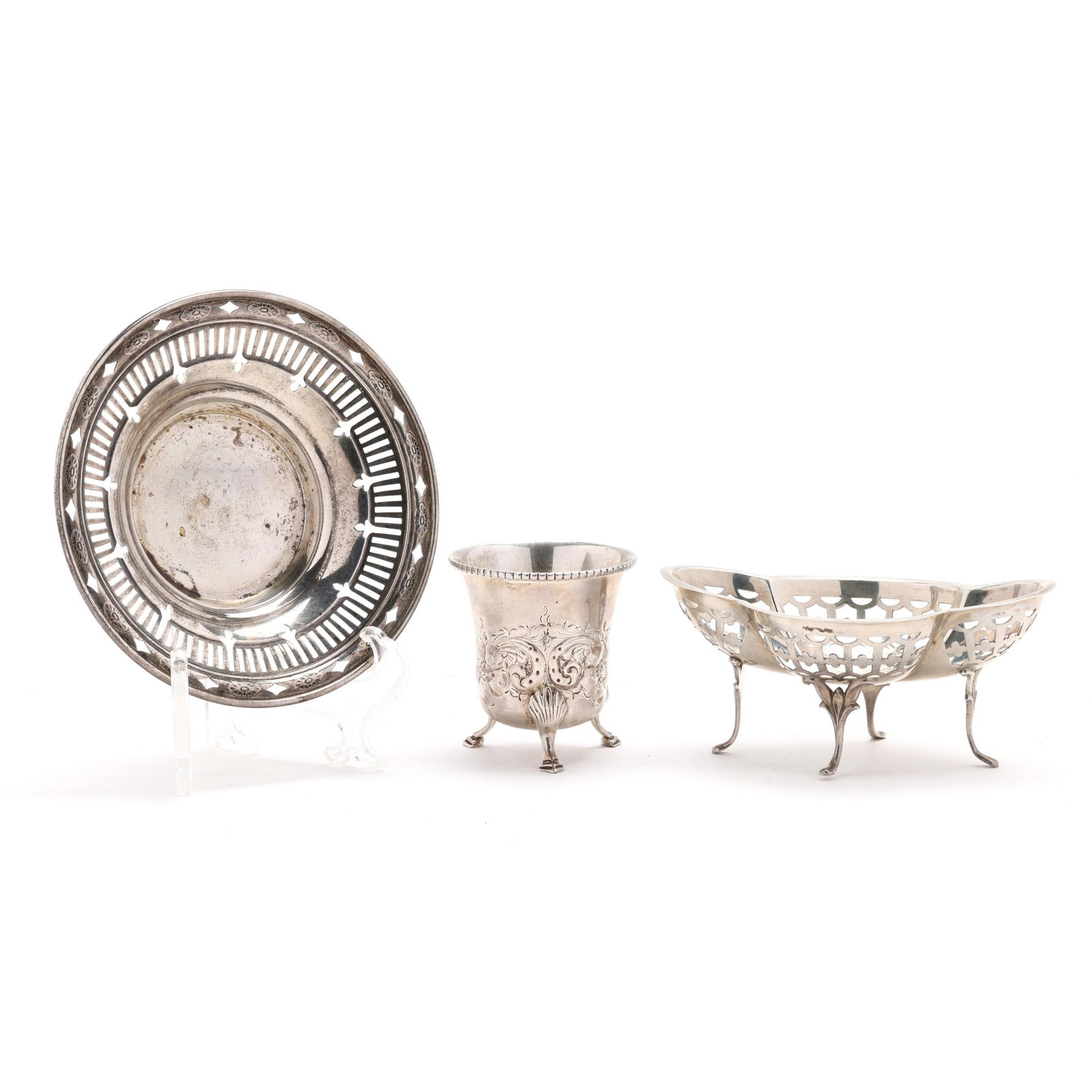 Three Silver Table Accessories: Three Silver Table Accessoriesthe first, a George V silver bon bon bowl, mark of William Hutton & Sons Ltd., Birmingham (1923), retail mark of J. E. Caldwell & Co., reticulated quatrefoil form with hi