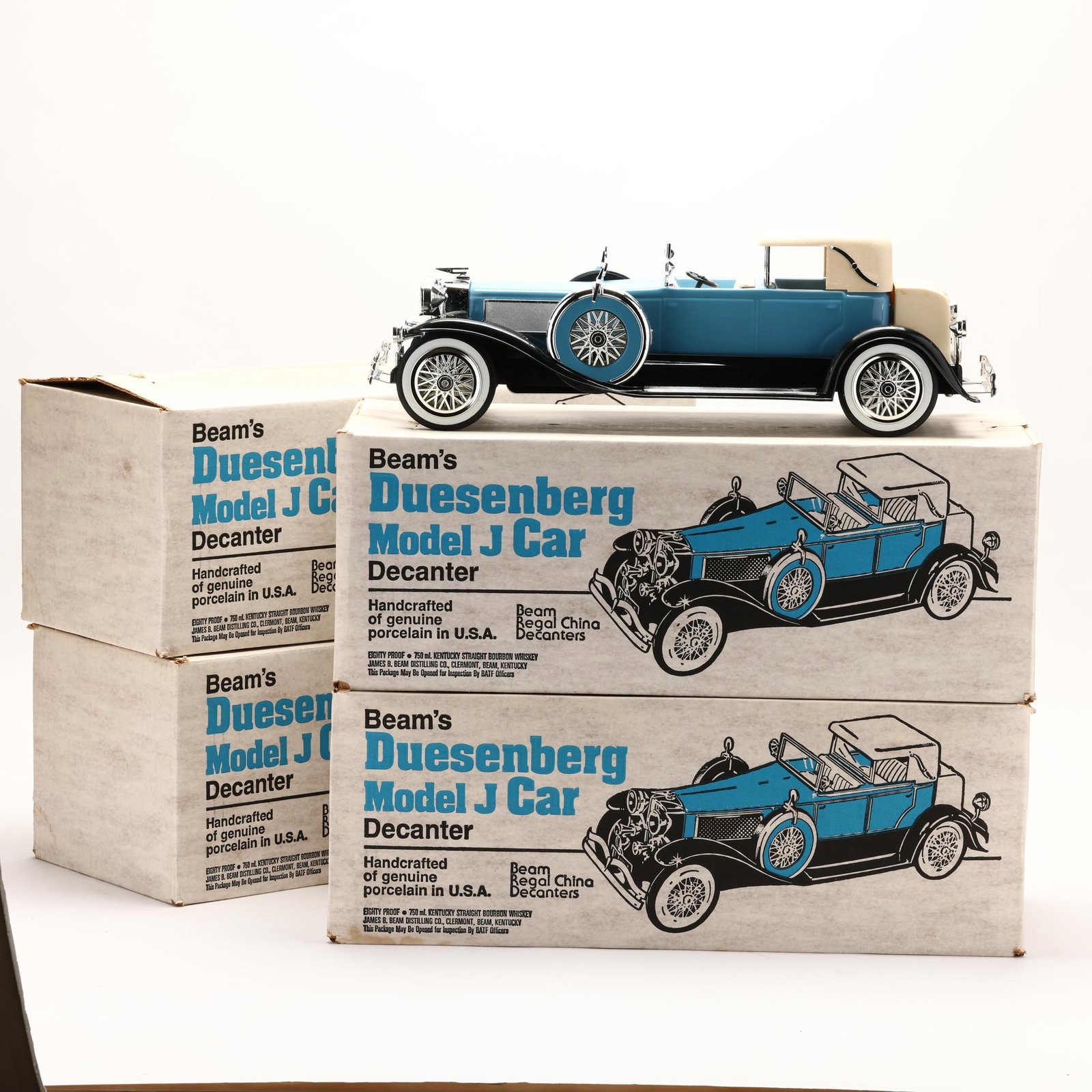 Jim Beam Bourbon Whiskey in Duesenberg Car Decanters: Jim Beam Bourbon Whiskey in Duesenberg Car DecantersCar decanters sold may have minor chips, discolorations or small pieces detached/missing. Please refer to images. The buyer acknowledges that he/she