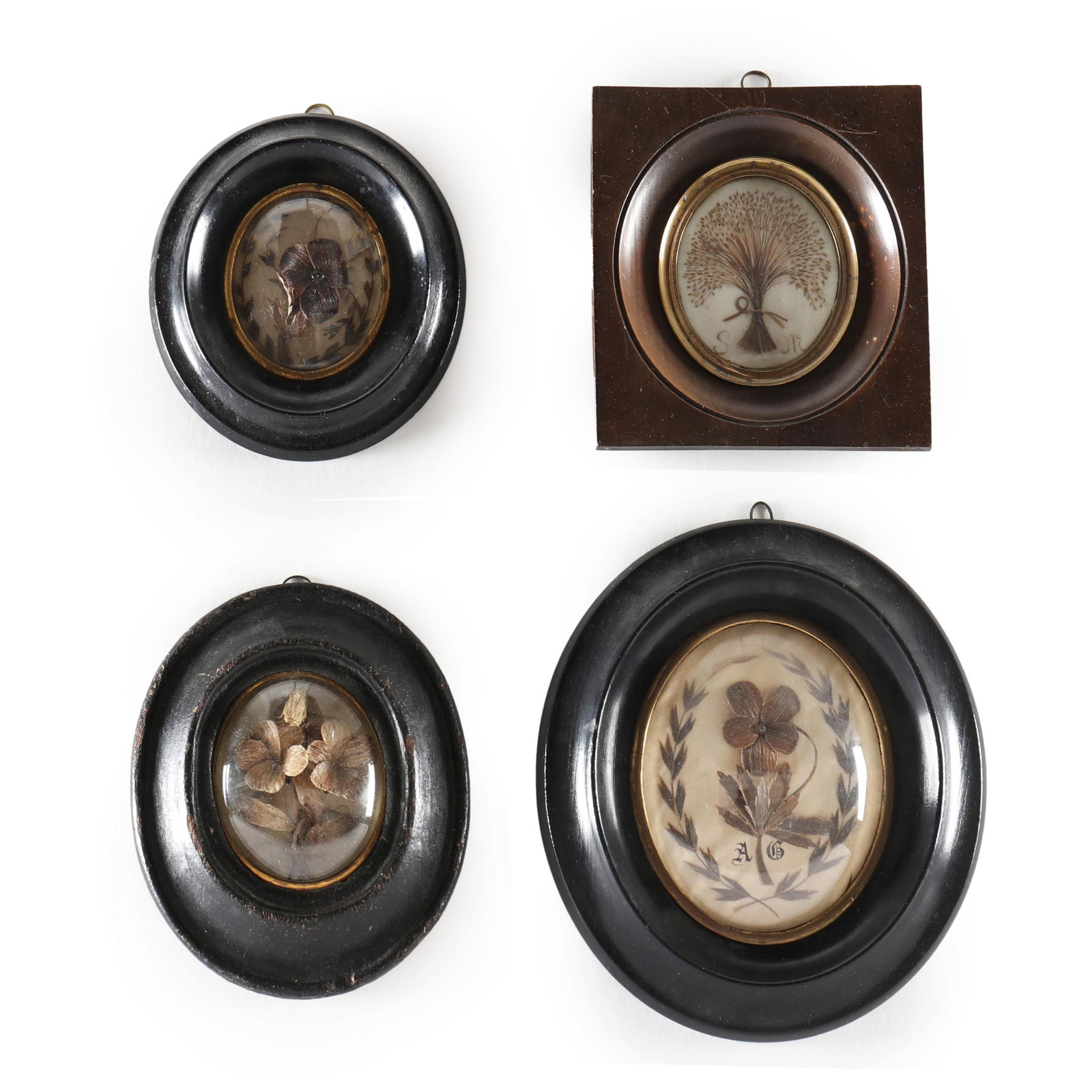 Four Framed Victorian Hair Memorials in a Floral Motif: Four Framed Victorian Hair Memorials in a Floral Motifthree housed in oval frames with gilt liners, one with initials AB (8 x 6.75 in. largest); and one in a rectangular frame with initials SM (5.75 x