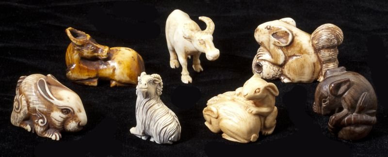 Group of Seven Animal Netsuke: Group of Seven Animal Netsuke all likely ivory, to include (2) rabbits, a ram, (2) oxen, a squirrel and a mouse, all with tinted detail. One ox is actually a carving without apertures. 1 in. to 1.5 in