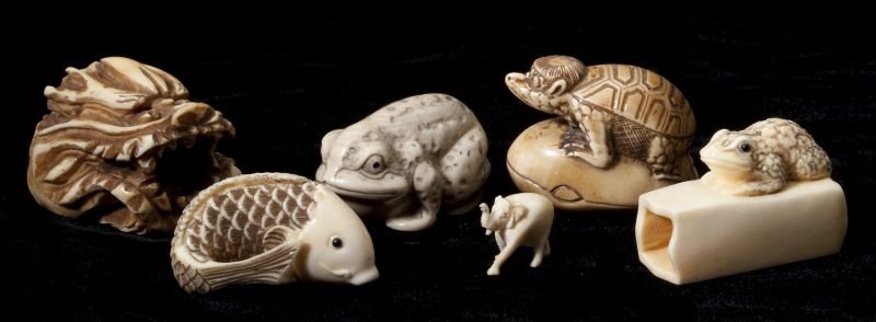 Group of Six Ivory Animal Form Carvings: Group of Six Ivory Animal Form Carvings to include (5) turtle netsuke, (2) frogs, a koi, and mythological mask as well as a miniature elephant, with tinted highlights. .5 in. to 1.5 in. Estate of Denn