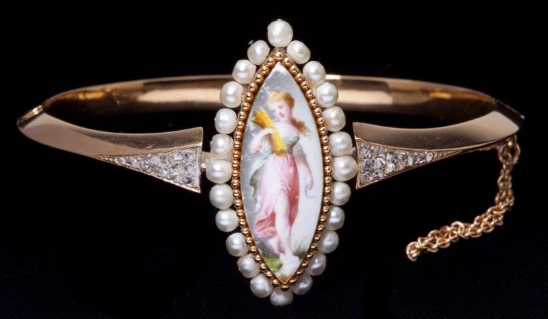 Antique Limoges, Pearl, & Diamond Bangle Bracelet: Antique Limoges, Pearl, & Diamond Bangle Bracelet Continental, circa 1900, centering on a navette shaped hand-painted porcelain plaque measuring approximately 25.5mm x 9.5mm, depicting a lady with a s