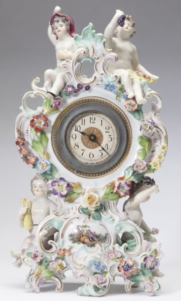 Carl Thieme Dresden Mantel Clock: Carl Thieme Dresden Mantel Clock late 19th-early 20th century, decorated in a romantic Rococo style with putti representative of the "Four Seasons," the brass and glass enclosed clock face is encircle