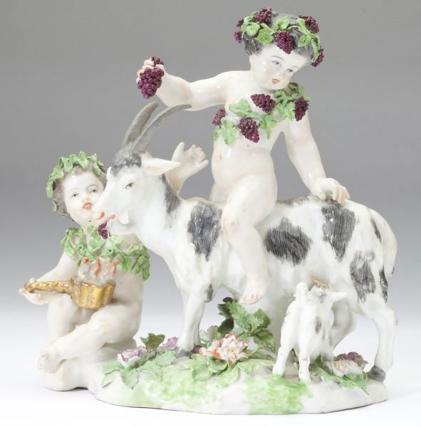French Figural Group by Edme Samson: French Figural Group by Edme Samsonmodeled as two putti, draped in laurel and grape leaves, feeding a goat who in turn is nursing a kid, upon a floral encrusted base.7.5 x 7 in.Private Collection, Cha