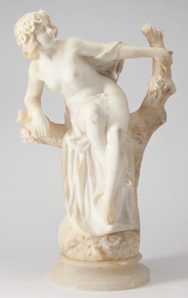 Italian Alabaster Sculpture: Italian Alabaster Sculptureillegibly signed on the verso and dated '96, inscribed "Firenze," a bare-breasted woman depicted seated in a blossoming tree, mounted atop a circular plinth.19.75