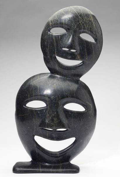Canadian Inuit Carved Stone Mask Sculpture: Canadian Inuit Carved Stone Mask Sculpture by Pete Koyso, Cape Dorset, 1988, #879-980, highly polished dark green hardstone with subtle white and yellow striations. 18.75 in. Collection of Mr. Samuel 